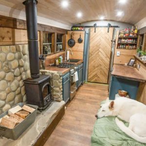 Couples DIY Off Grid Raised Roof School Bus Conversion Tiny House